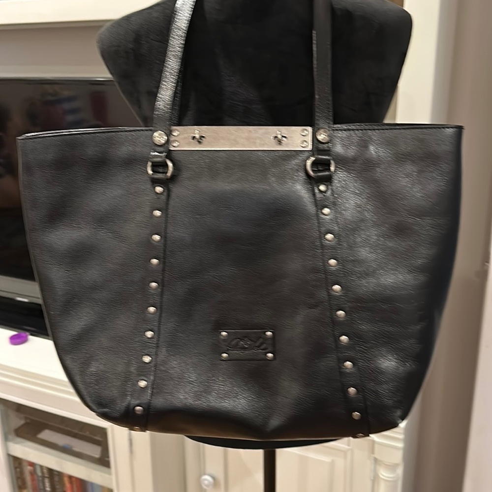 Patricia Nash black leather metal studded bag.